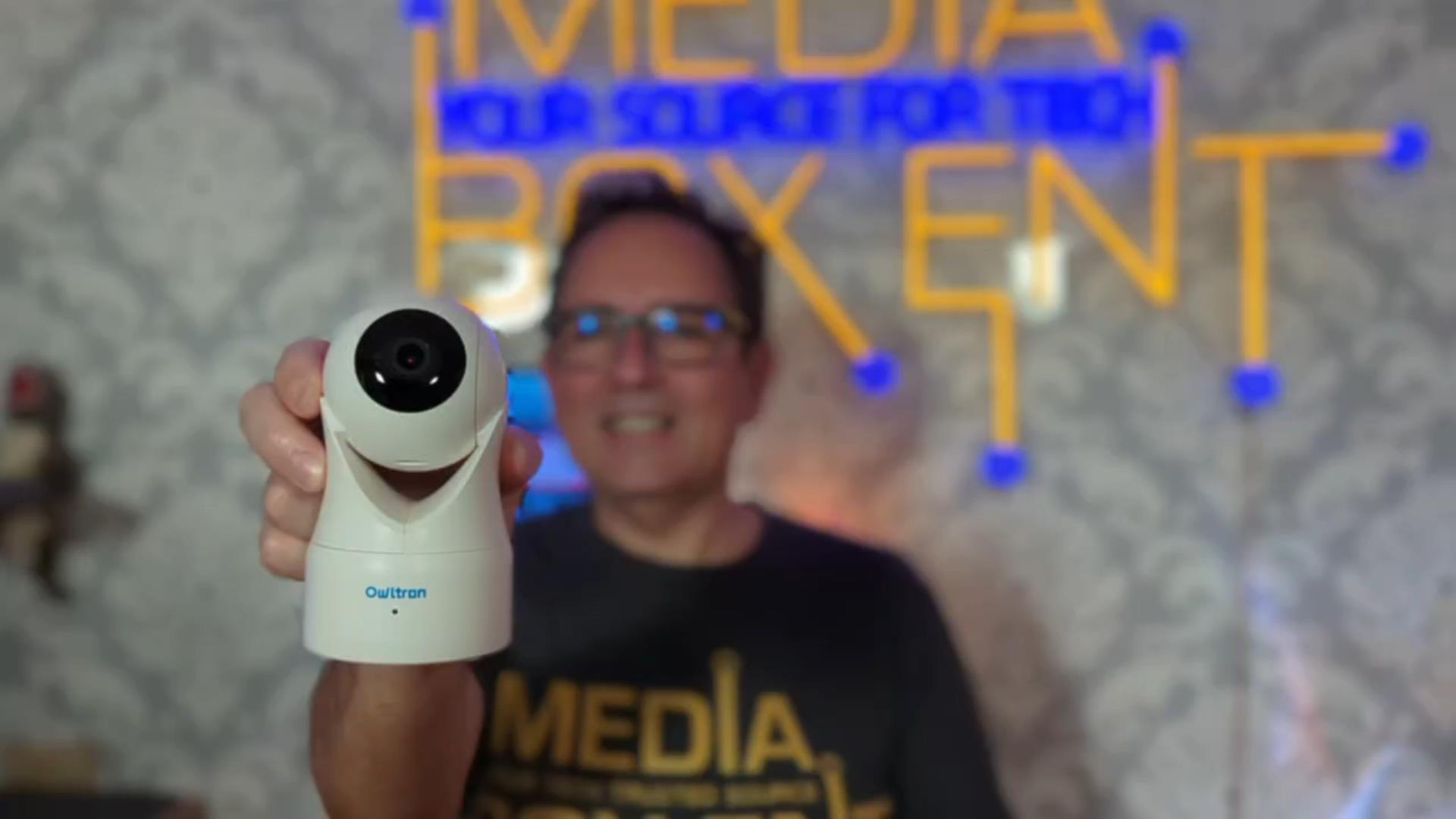 Dario, from MediaBoxEnt, holding the owltron Pet Camera, with the logo